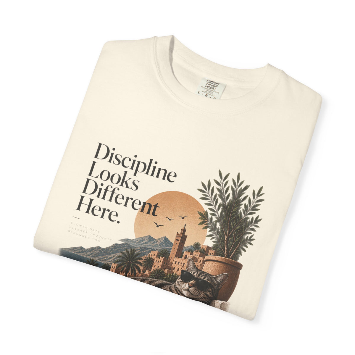 T-Shirt — "Discipline Looks Different Here" Sunset Cat Graphic