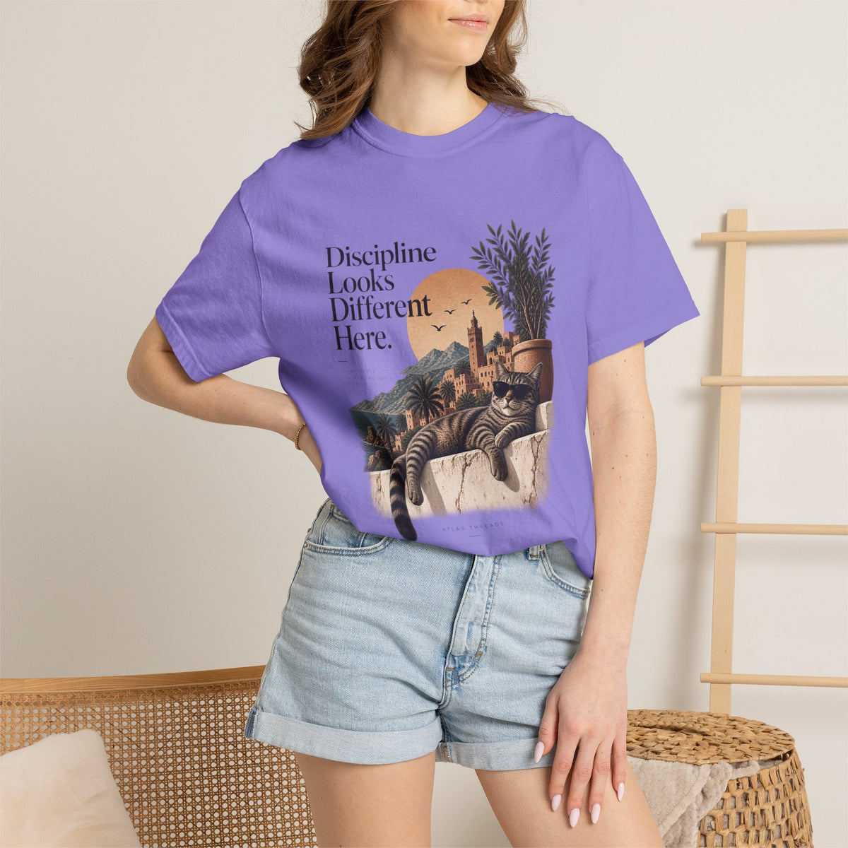 T-Shirt — "Discipline Looks Different Here" Sunset Cat Graphic