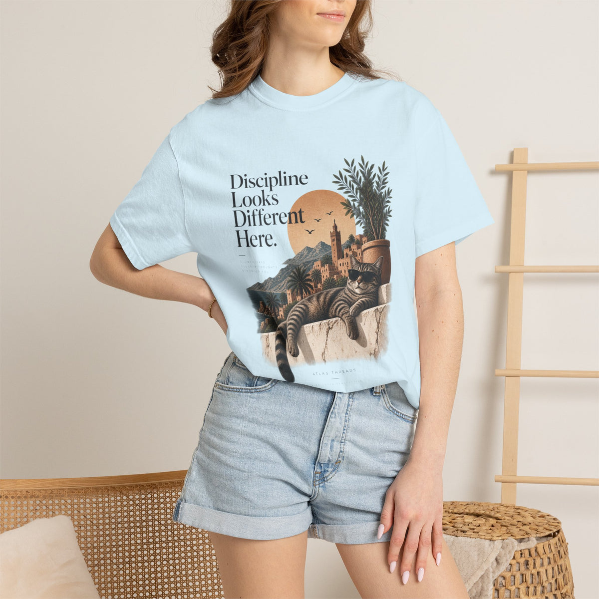 T-Shirt — "Discipline Looks Different Here" Sunset Cat Graphic