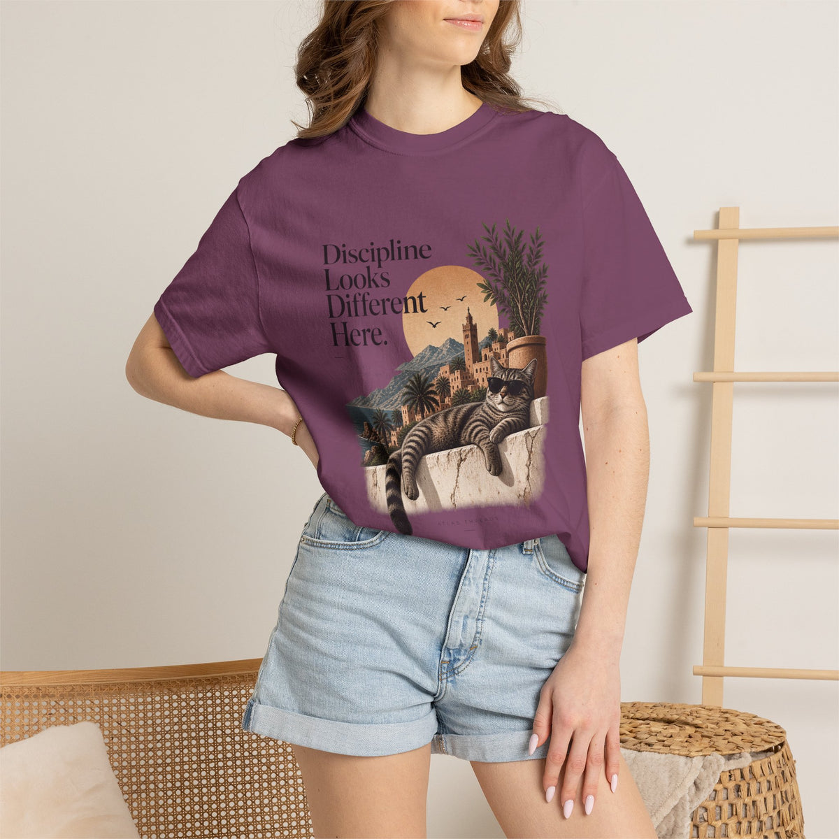 T-Shirt — "Discipline Looks Different Here" Sunset Cat Graphic