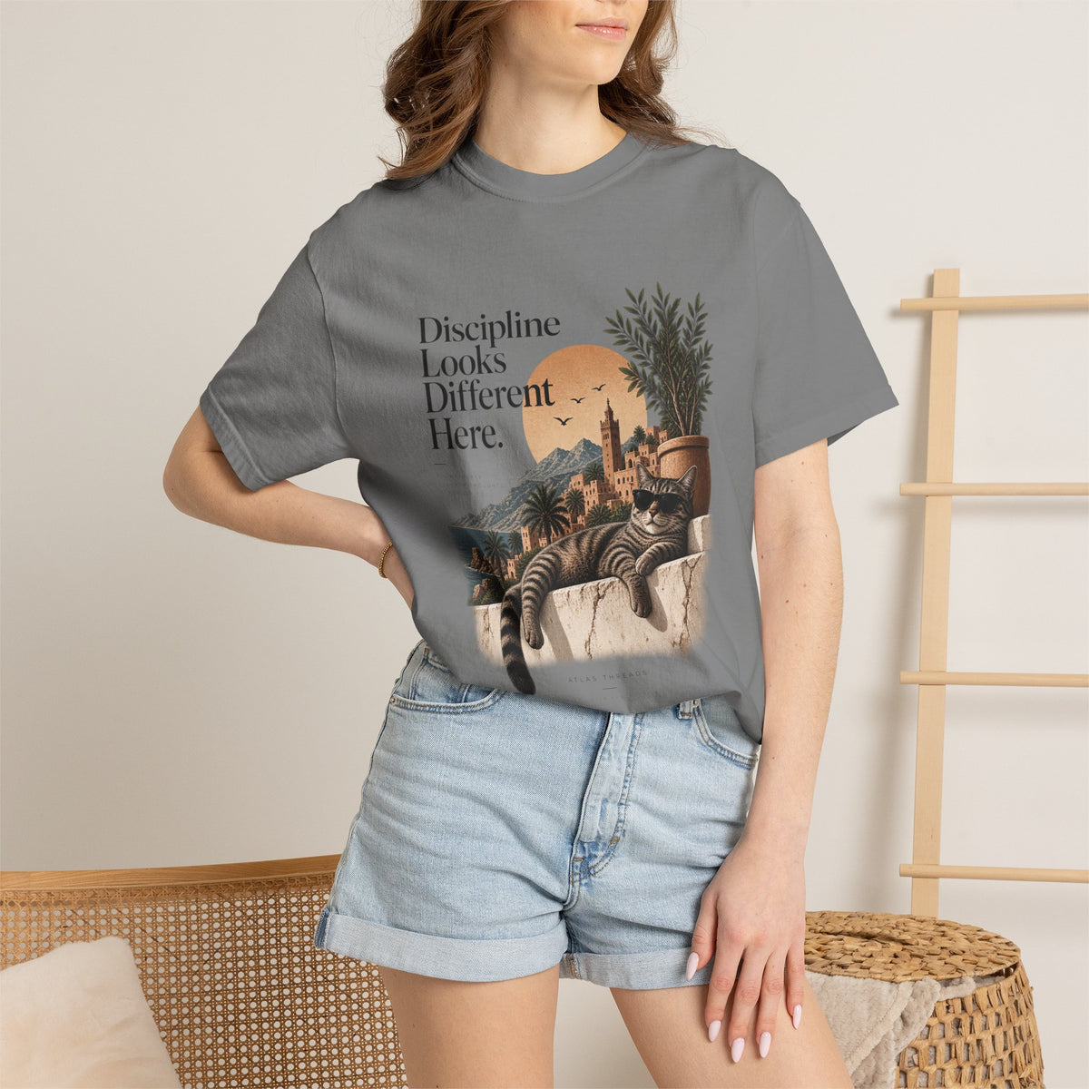 T-Shirt — "Discipline Looks Different Here" Sunset Cat Graphic