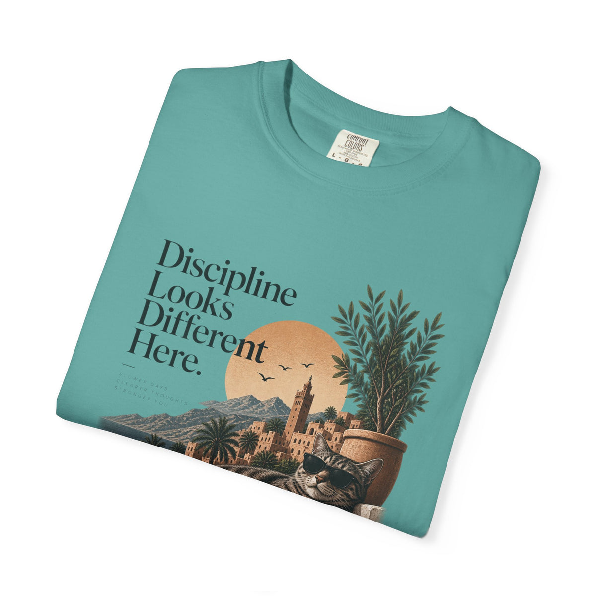 T-Shirt — "Discipline Looks Different Here" Sunset Cat Graphic